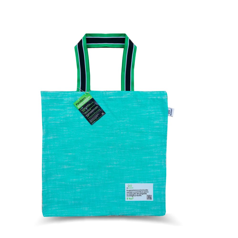 Green Aqua Shopping Bag with Green and Black Handles. Jacquard brand label and label printed in water-based ink and biodegradable materials